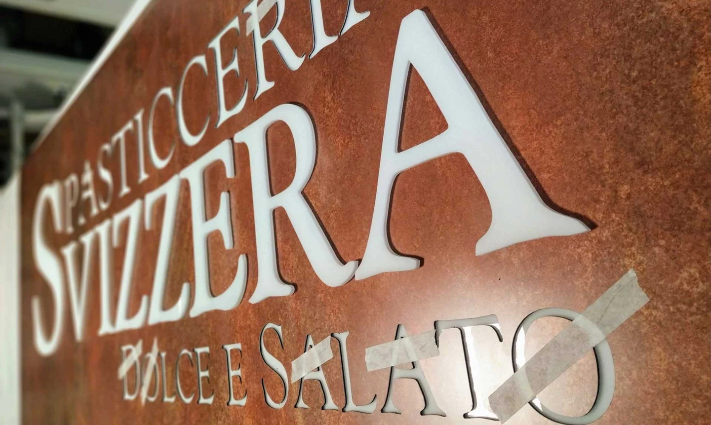 Corten-effect Dibond sign with raised acrylic lettering