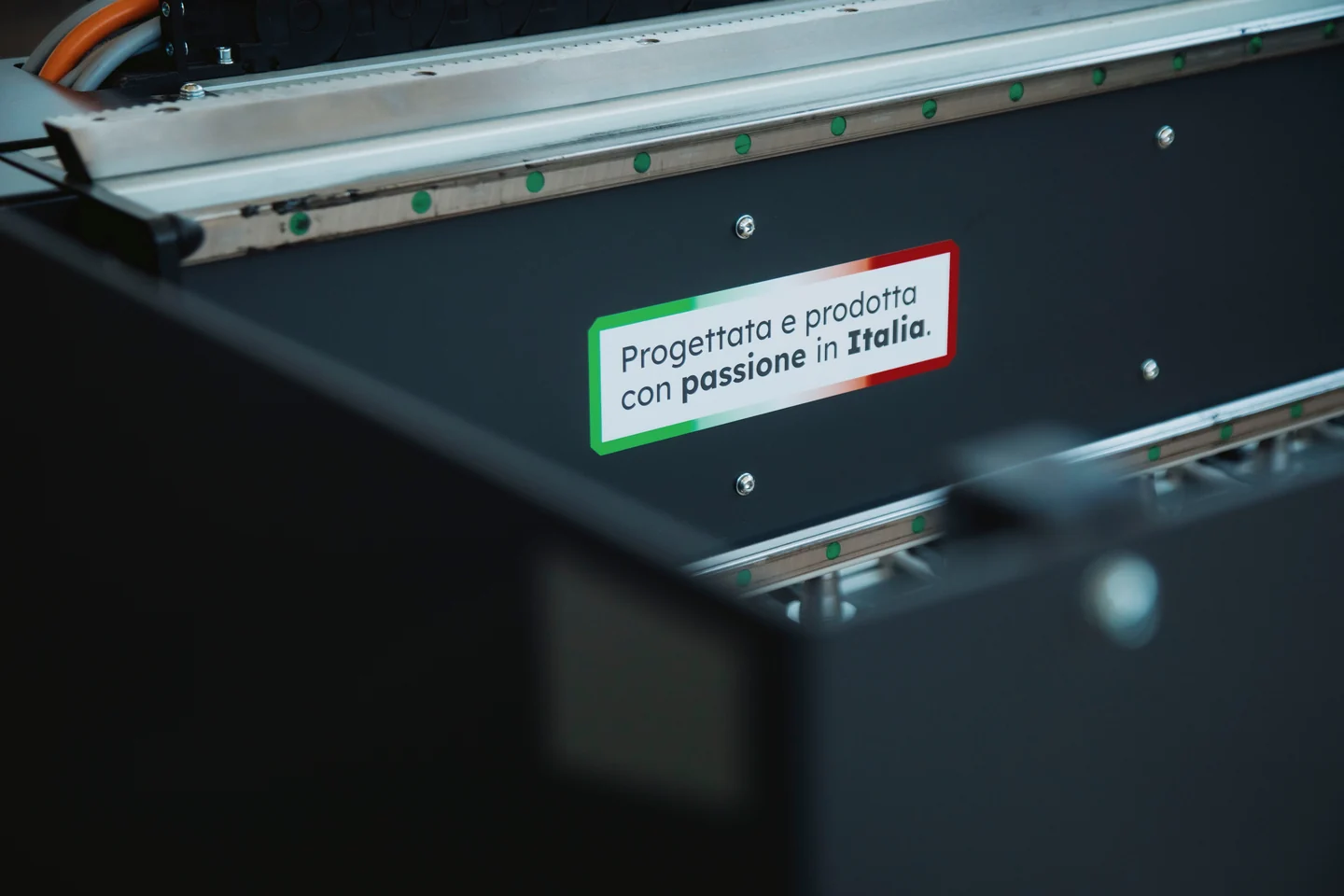 The “Designed and built with passion in Italy” plate on a TEKNO CNC router